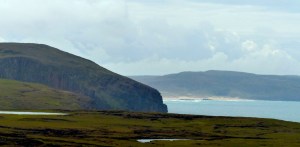 A distant, hazy Sandwood Bay